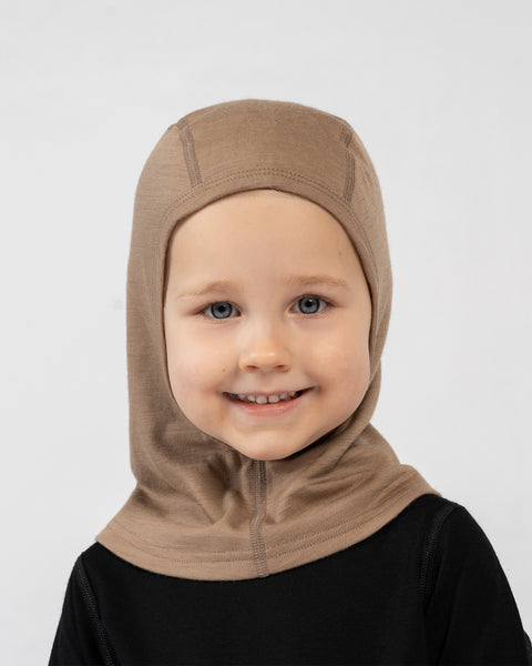 Kids merino wool balaclava in beige, soft breathable merino headwear for warmth and comfort.
