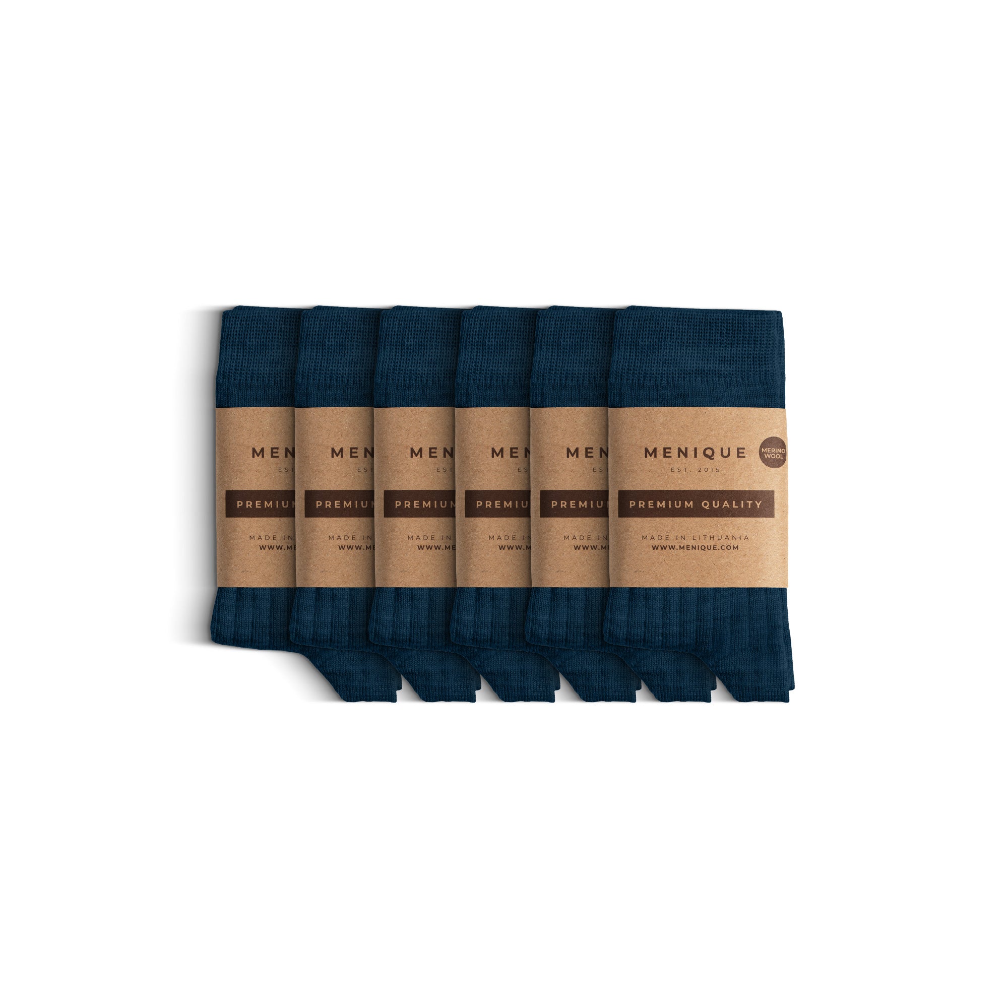 Six pairs of thin ribbed kids’ socks in soft pink, neatly folded and wrapped with Menique brown paper labels that read ‘Premium Quality.