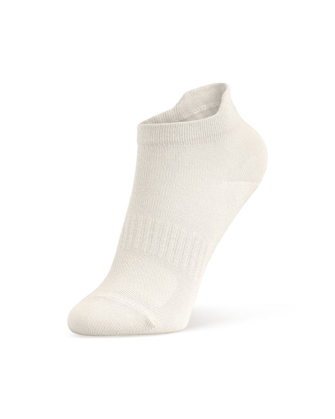 A product shot of a single white ankle sock, filled out to display its shape as if worn on a foot, standing upright at an angle against a white background.