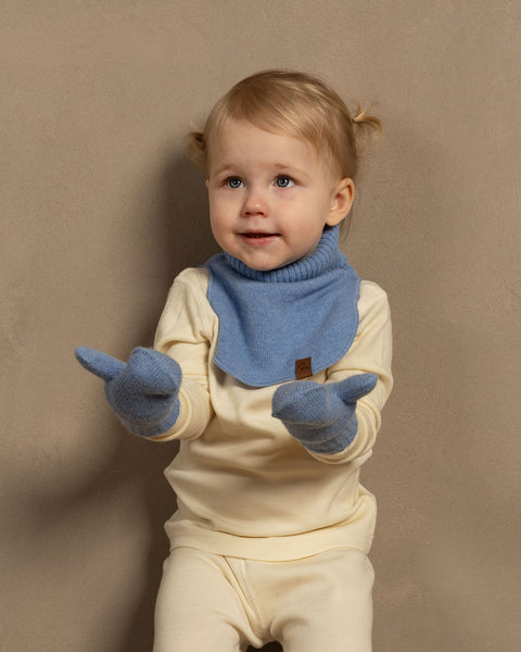 Little girl wearing merino wool long sleeve top and pants with knitter merino wool cashmere dickie in light blue