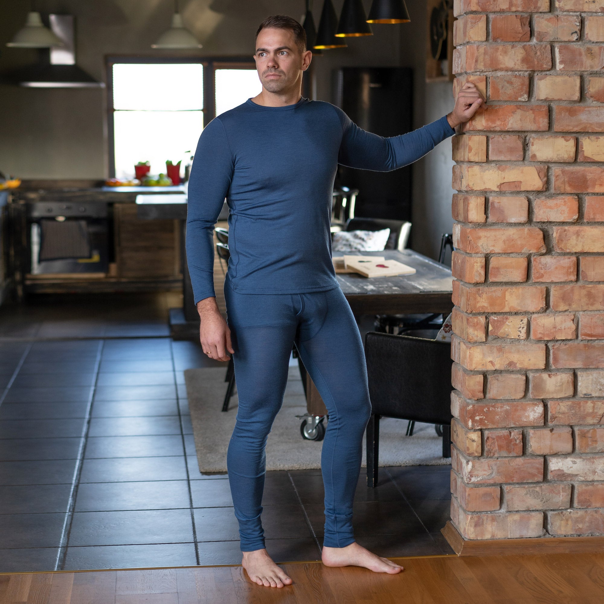 Gifts for men | A man wearing merino wool set of long sleeve and pants in blue denim color