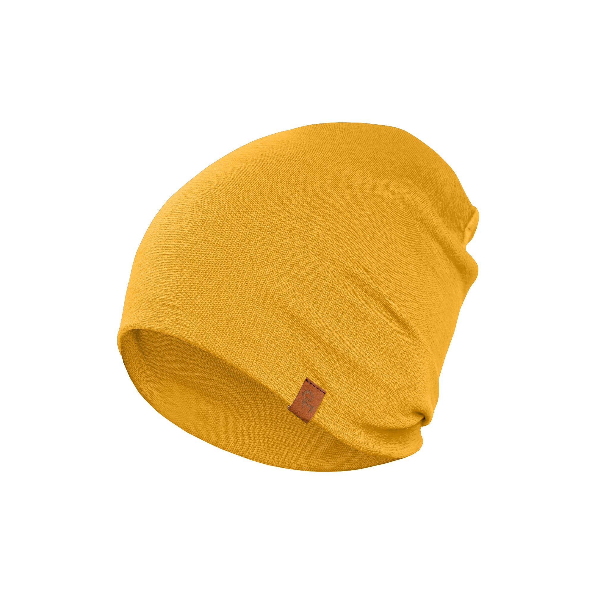 A man with short brown hair and a beard is shown in a profile view, wearing a spicy yellow merino wool beanie and a black t-shirt. He appears to be looking off to the left. The background is plain white.