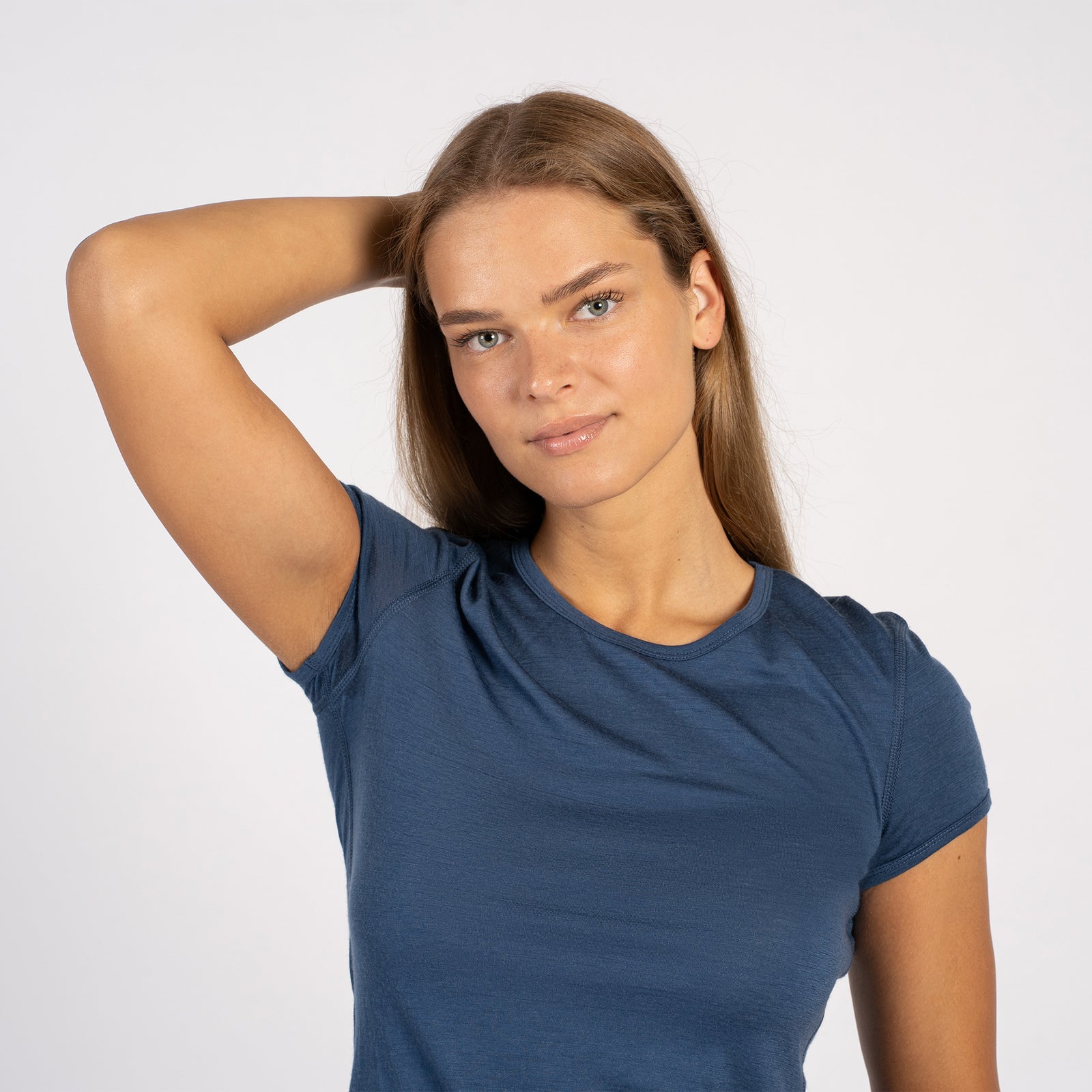 Side view of model wearing denim Merino T-shirt – soft lightweight wool tee