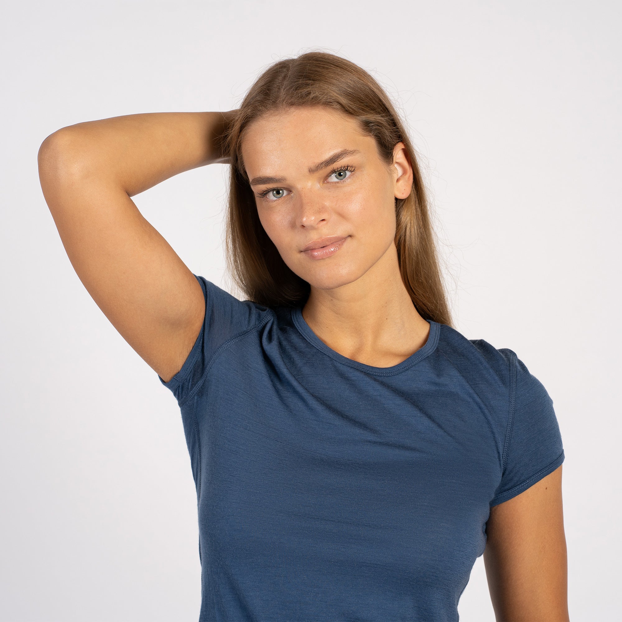 Side view of model wearing denim Merino T-shirt – soft lightweight wool tee