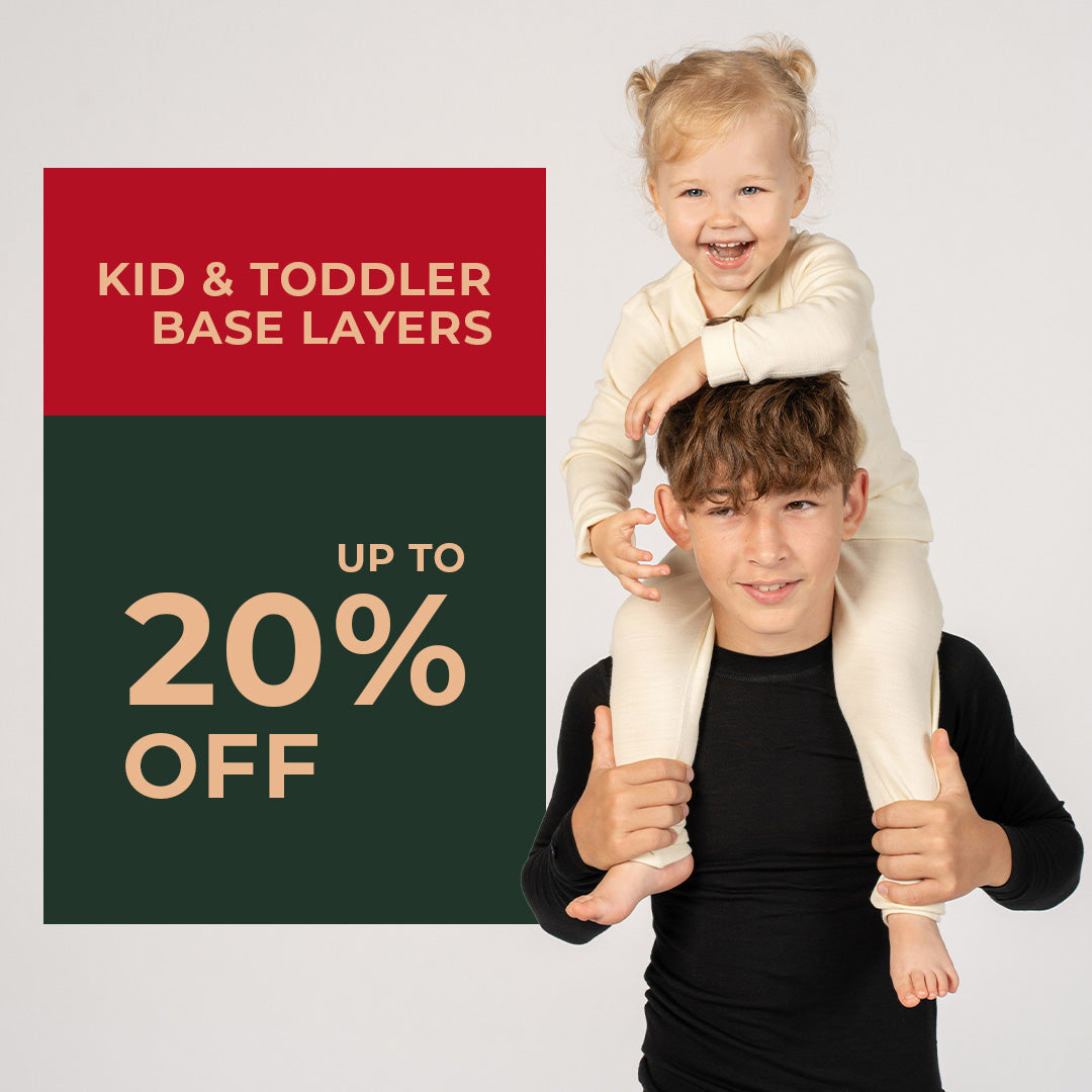 Teenager boy holding little toddler girl on his shoulders, they both wearing 100% Merino wool clothing. Kids & Toddlers Base layers on sale up to 20% off.