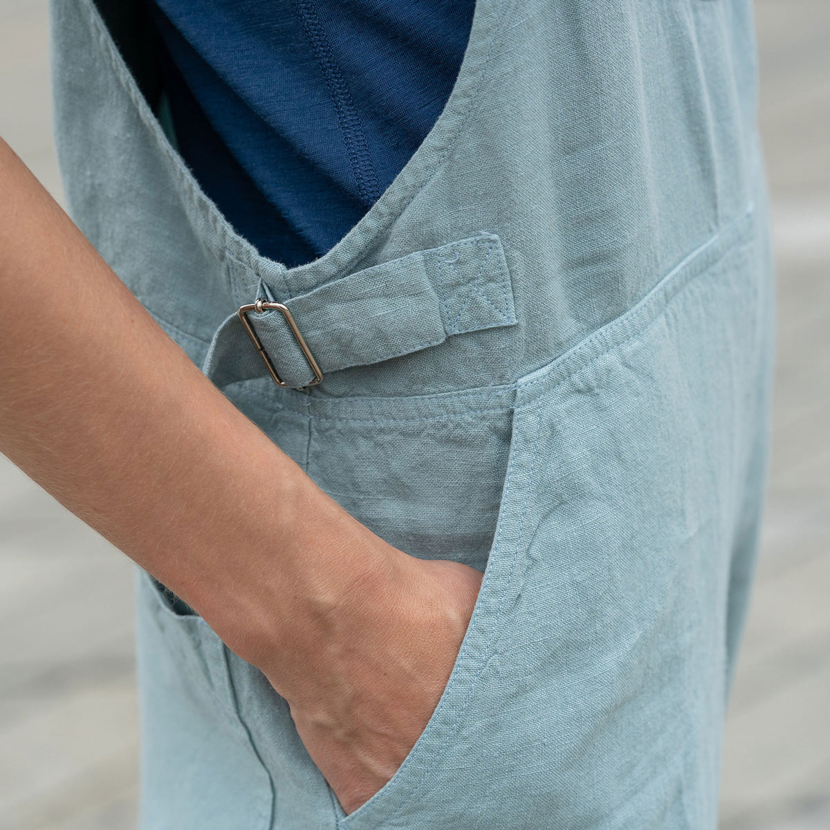 Gorgeous woman in a city, wearing mint green linen Jumpsuit Nicci.